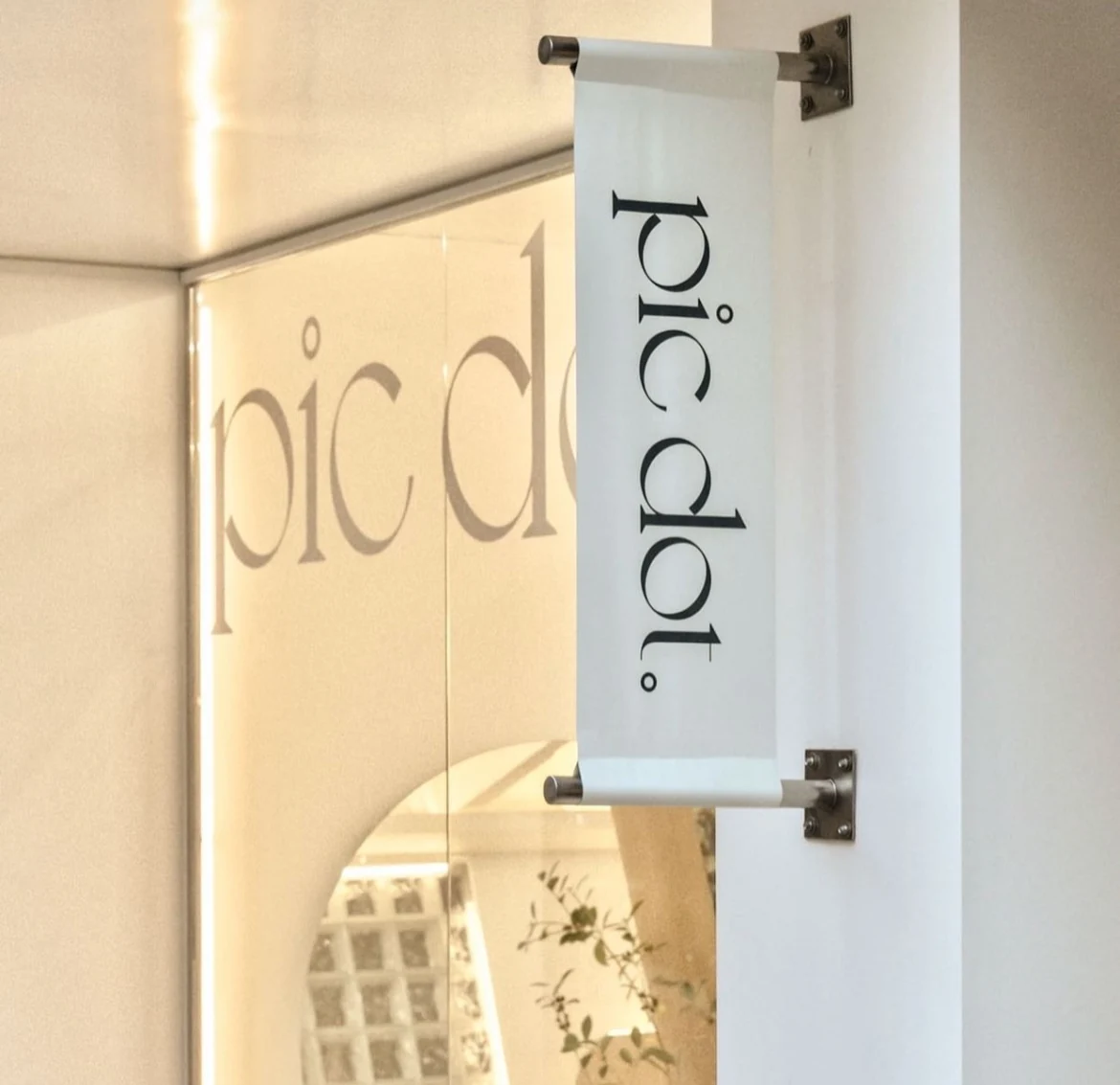 Pic Dot. self-photo studio in Apgujeong Rodeo — A slender fabric sign at the entrance.