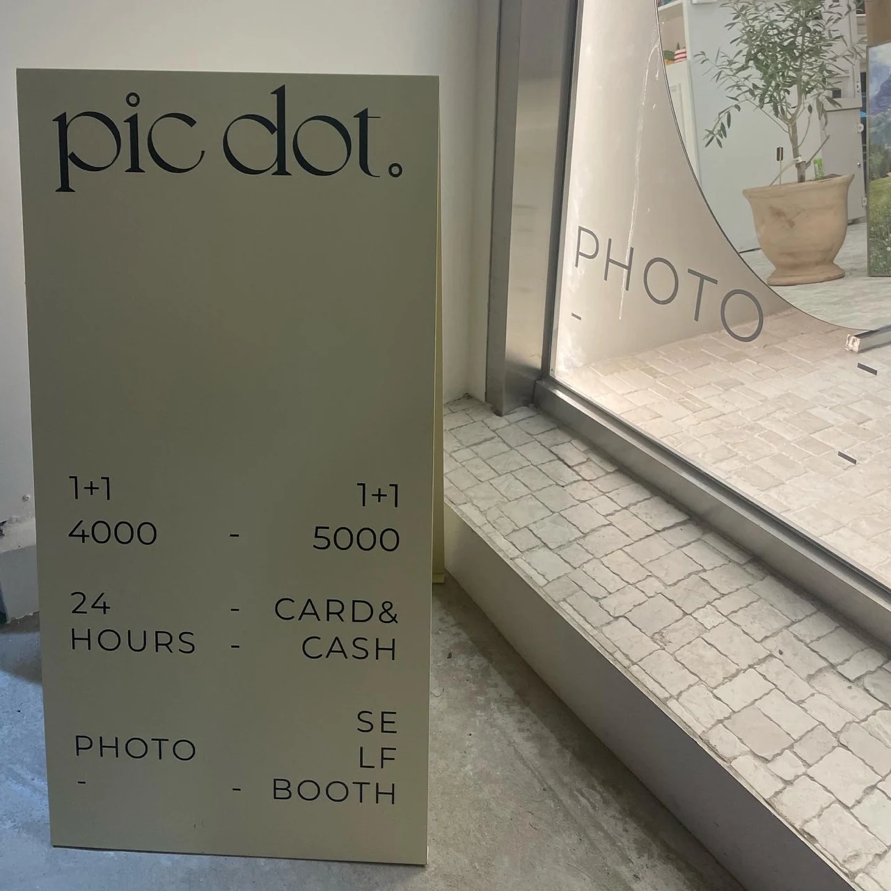 Pic Dot. self-photo studio in Apgujeong Rodeo — A freestanding sign completes the threshold.